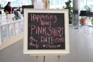 The blackboard outside of AC Hub indicating the Pink Shirt Day.