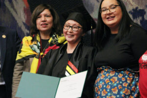 Lilia Taiberei (middle) receiving her courage to soar diploma during the graduation ceremony held at the National Arts Centre on March 28. She is with Anita Tenasco (left) and Sabrina Gideon (right).