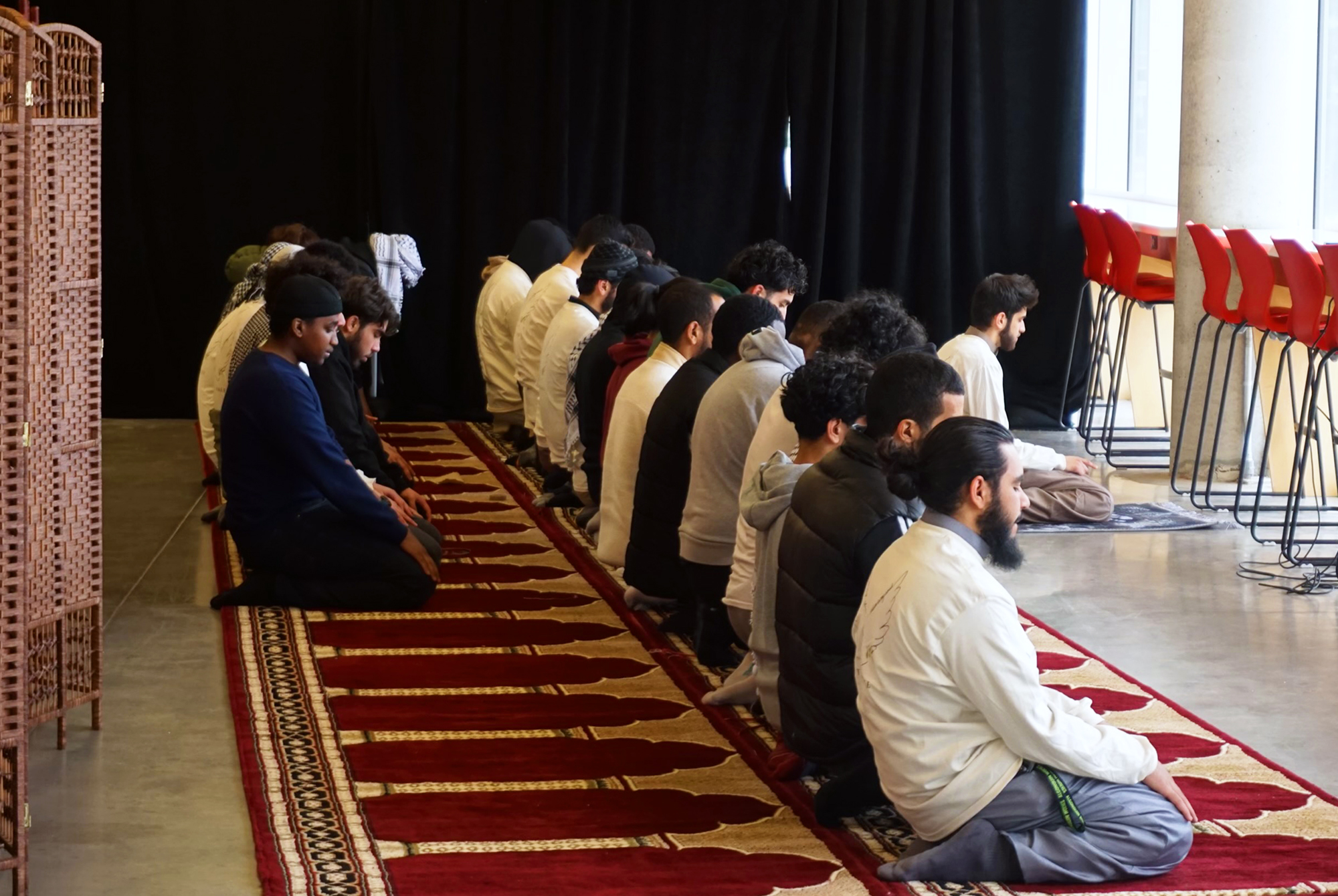 Muslim students pray in the Corner Lounge of the E building at Algonquin College.