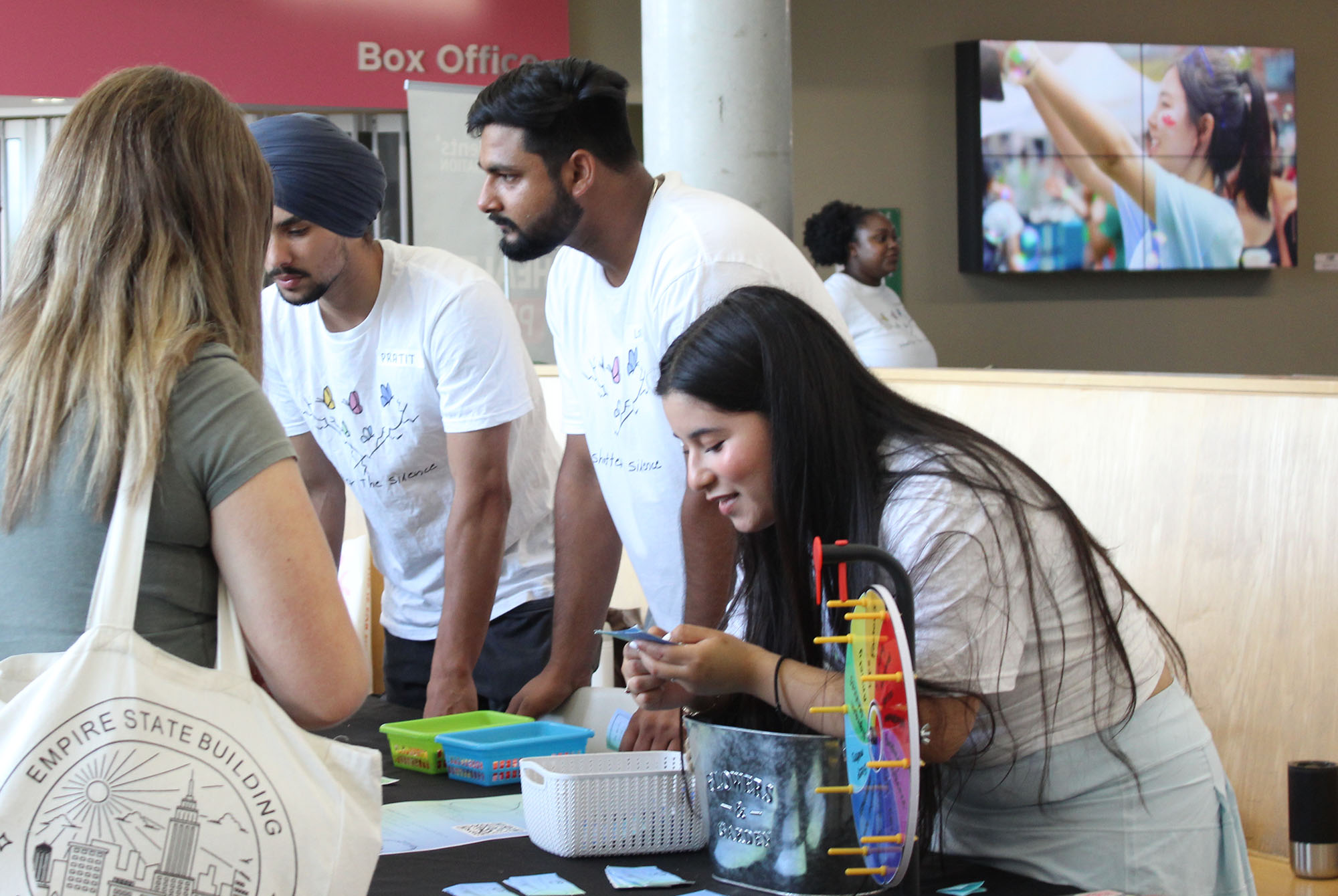 Ximena Luna (right),Lokender Singh (centre) and Pratit Singh (left) explaining the game to workshop attendees
