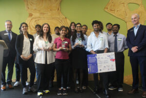 The winning teams posing on stage after the awards distribution.