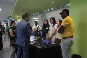 The Aerospace Experience 2025 project members explaining their project to the judges