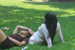 Lois Caracas, level 2 public relations student, said: "We have to find creative places to sit down outside because the heat is so bad. Being on the grass, shaded by the trees helps us cool down."