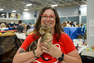 Kim Monkhouse, President and Treasurer of the Ottawa Valley Cat Club holding a kitten at the Ottawa Cat Show in the Curling Rink of the Nepean Sportsplex on Sept. 28.