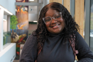 Chauncy Gonzague, a third-year student in the early learning and community development program, posing in C-building.