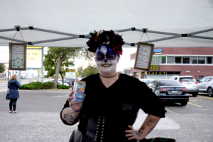 Jenn Ducharme, owner of The Goblin's Nest Odds and Ends holding one of her homemade wrapped cups at the Nepean Night Market on Oct. 6. Photo credit: Isabella Disley