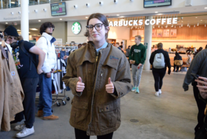 Abigail Chadwick-Gilmour, a first-year business management and entrepreneurship student, wearing her latest purchase at the Midday Picnic on Oct. 8 in the Student Commons building. Photo credit: Isabella Disley