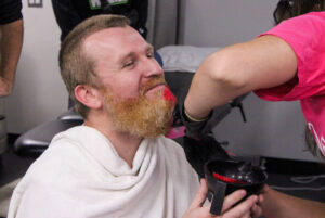 Jamie McLean getting his beard dyed pink for the "Shoot for the Cure" foundation by the Canadian Cancer Society.