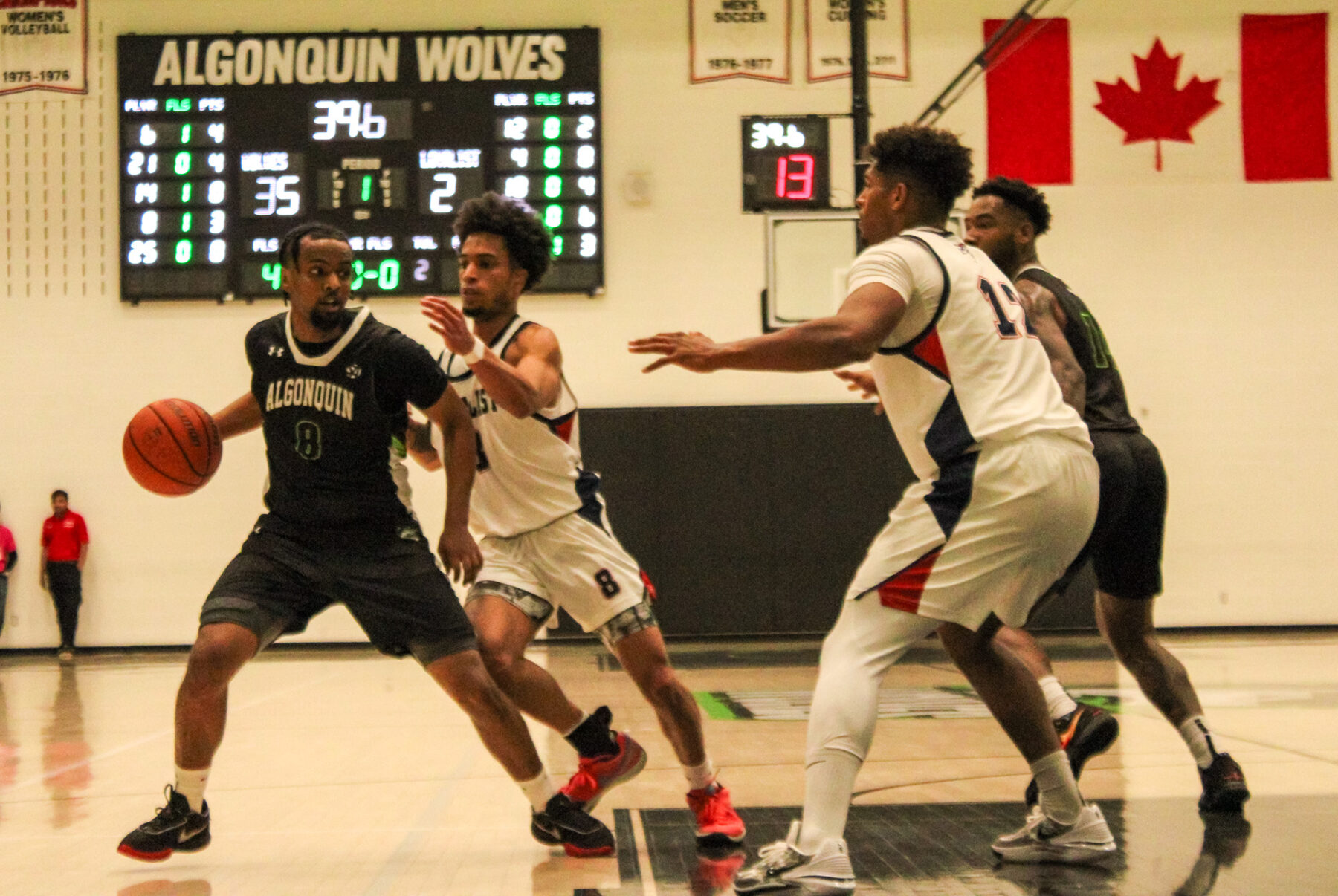 Simon Desta, Wolves guard, keeps the ball away from the Loyalist Lancers.