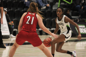 Wolves guard Dasia McDonald (right) works her way around St. Lawrence forward Laura Mallen (left). The game took place on Nov. 8 at the Jack Doyle Athletics & Recreation Centre, located at Algonquin College's Ottawa campus.