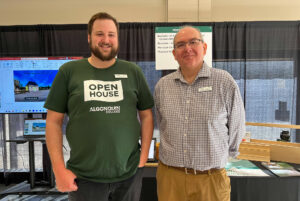 Photo of Ben Willows (left) and Dorren Taubman (right) representing the Algonquin College - Perth Campus at their booth