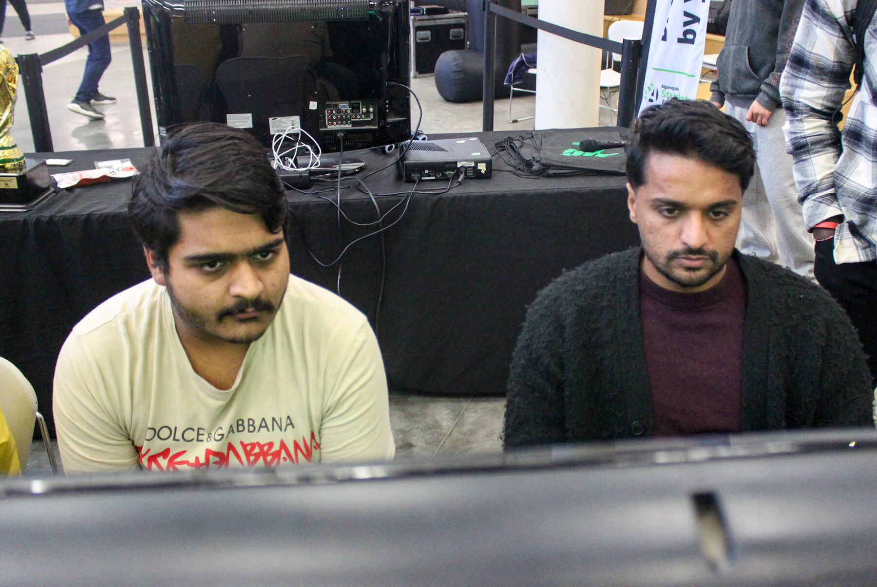 Shrenik Gupta, a Level 3 Mobile app design and development student, and Sahil Yadav, a Level 3 hairstyling student, playing a match.