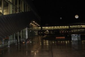 A quiet, rain-soaked campus at night