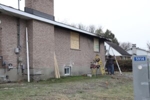 Workers are about to begin work on the northeast side of the house.