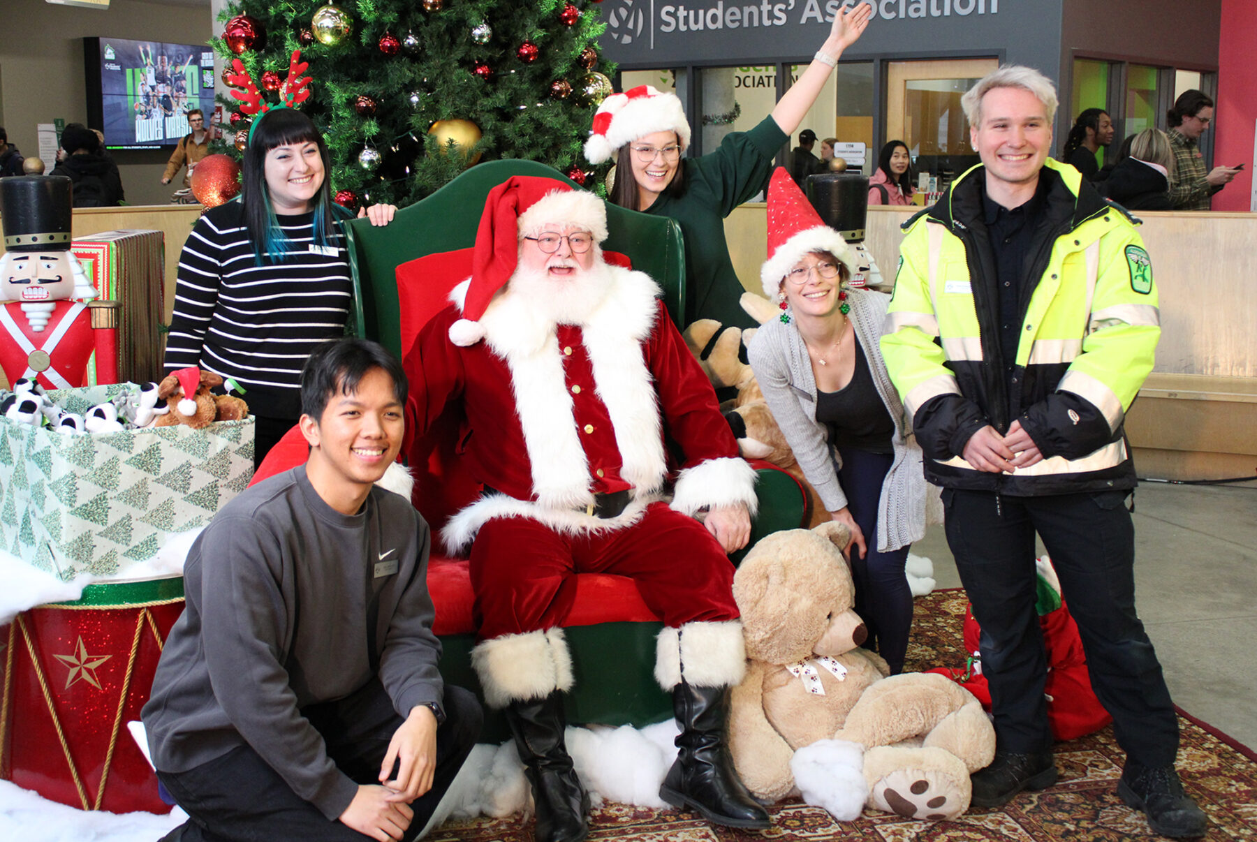 The Algonquin Students’ Association Board of Directors gets in on the action, being the first to get their photos taken with Santa Claus.