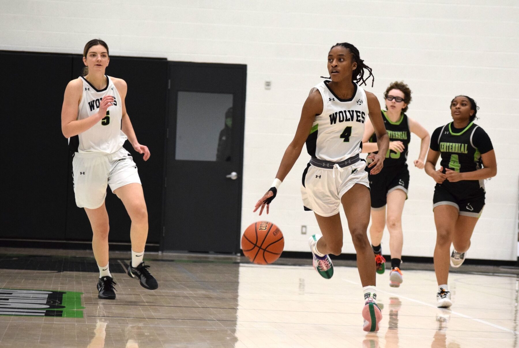 The Wolves' Dasia McDonald steals the ball from Centennial, making a quick breakaway during a game at the Jack Doyle Athletics and Recreation Centre on Jan. 11.