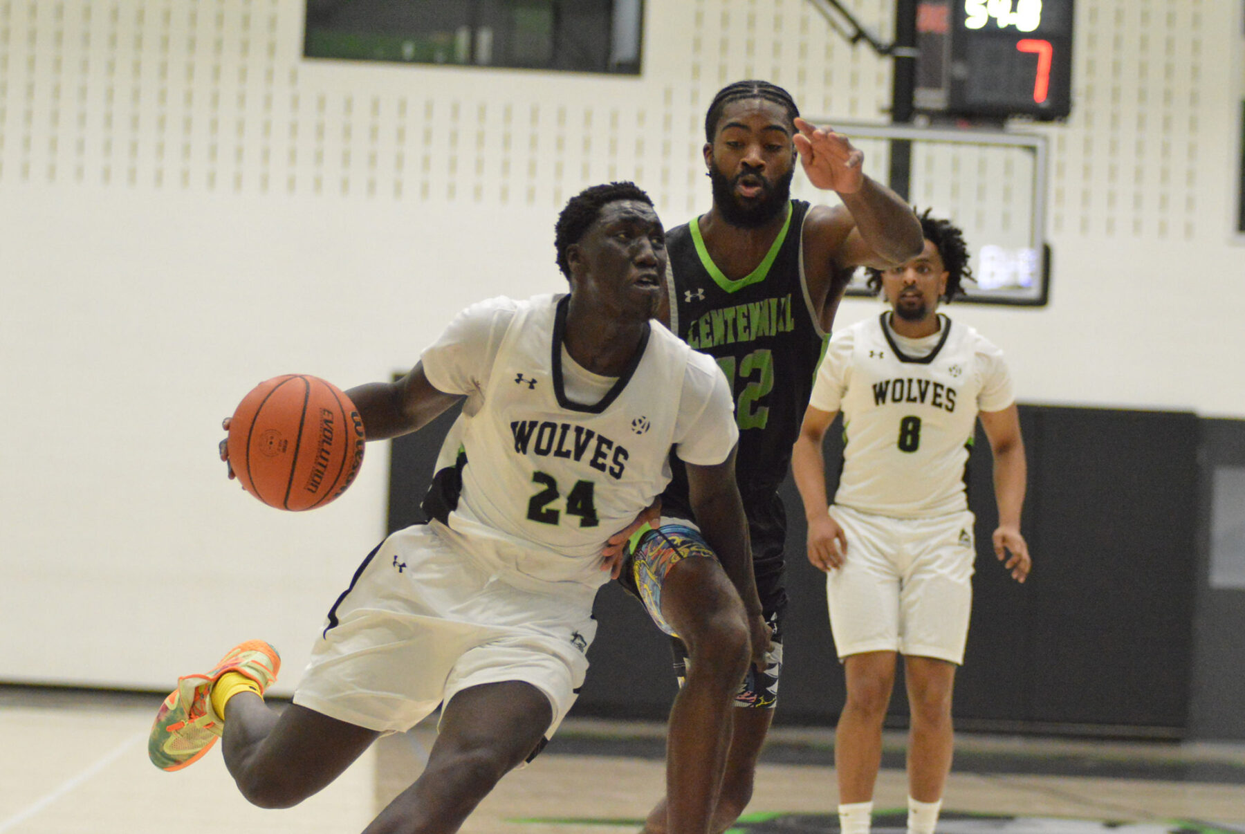 Tesloch Luk drives the basket under defensive pressure at the Jack Doyle Athletics and Recreation Centre.