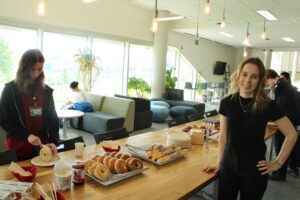 Event Officer Lauren Larocque, in front of Breakfast Bar in the AC Hub.