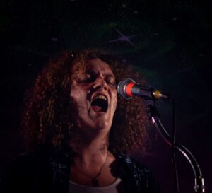 Thomas Burr performing with his band at House of TARG on May 29.