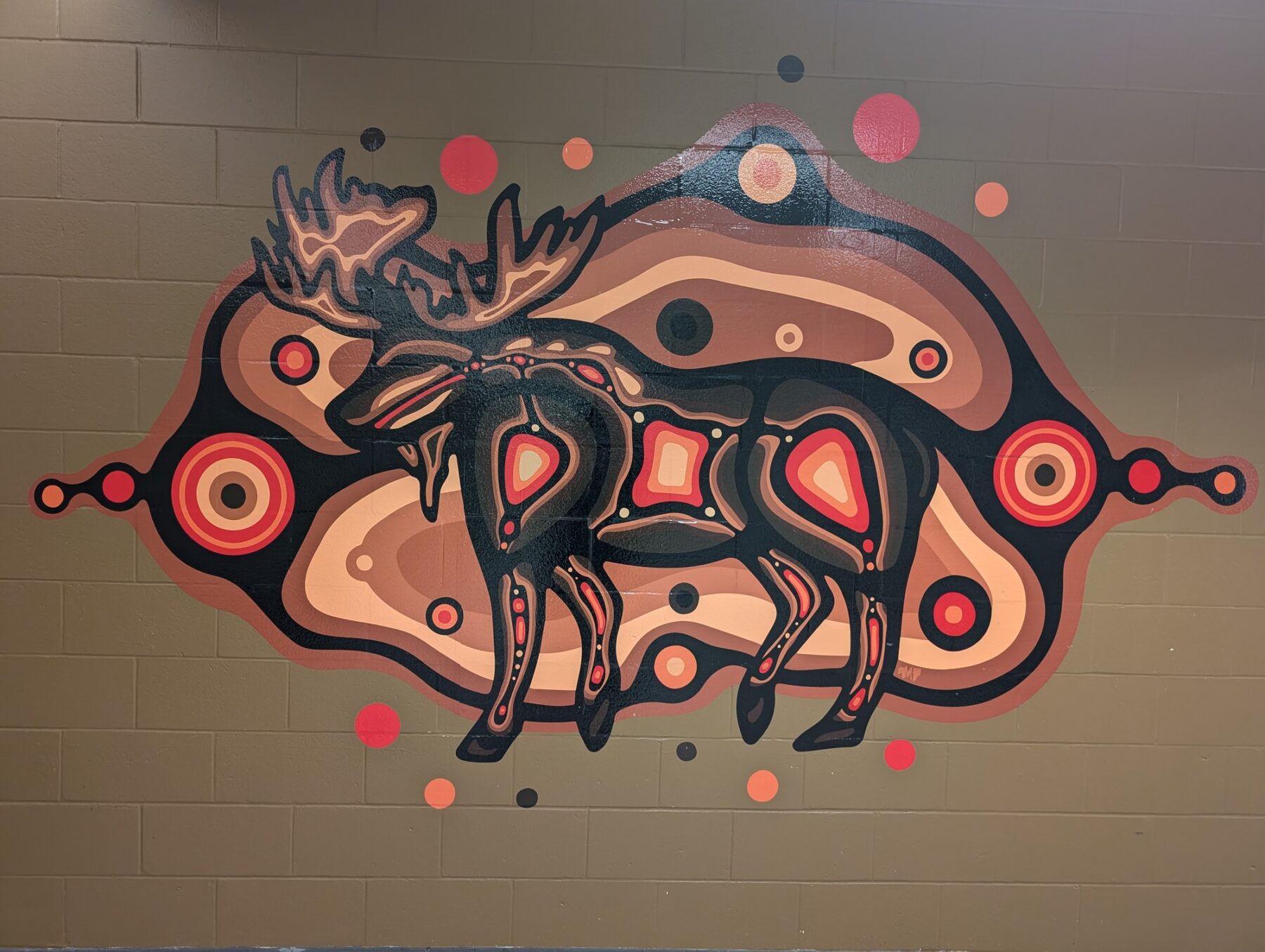 Monz (moose) is located at the Marketplace in the pathway from E-building to D-building.