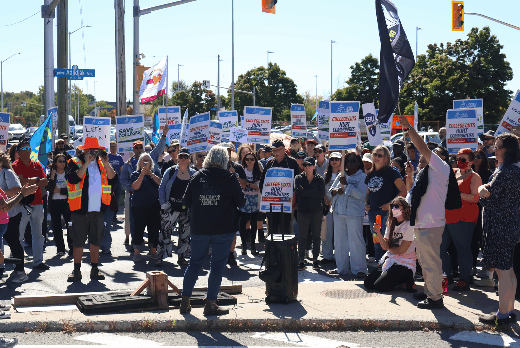 OPSEU Local 416 president and Algonquin College Assistive Technologist Catherine Kelsey (middle) speaking to the crowd during Friday's Solidarity Day of Action at the college.