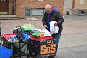 Gerald's cousin Michael Swerdfeger prepares wagons for outreach March 22, 2025.
