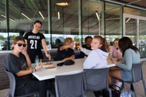 Police foundations students (from left to right) Miranda Mullen, McKenna Andreas, Christian Torres Lara, Ariel Buligo, Heather McLaughlin, Naomi Ward and Maya Thompson hang out at the Wolves Den patio on Sept. 10.