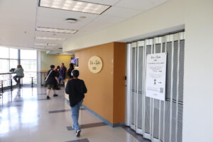 Algonquin College students walking past the closed Bits n' Bytes in T-building