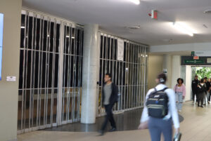 Students walking past the closed Booster Juice in E-building