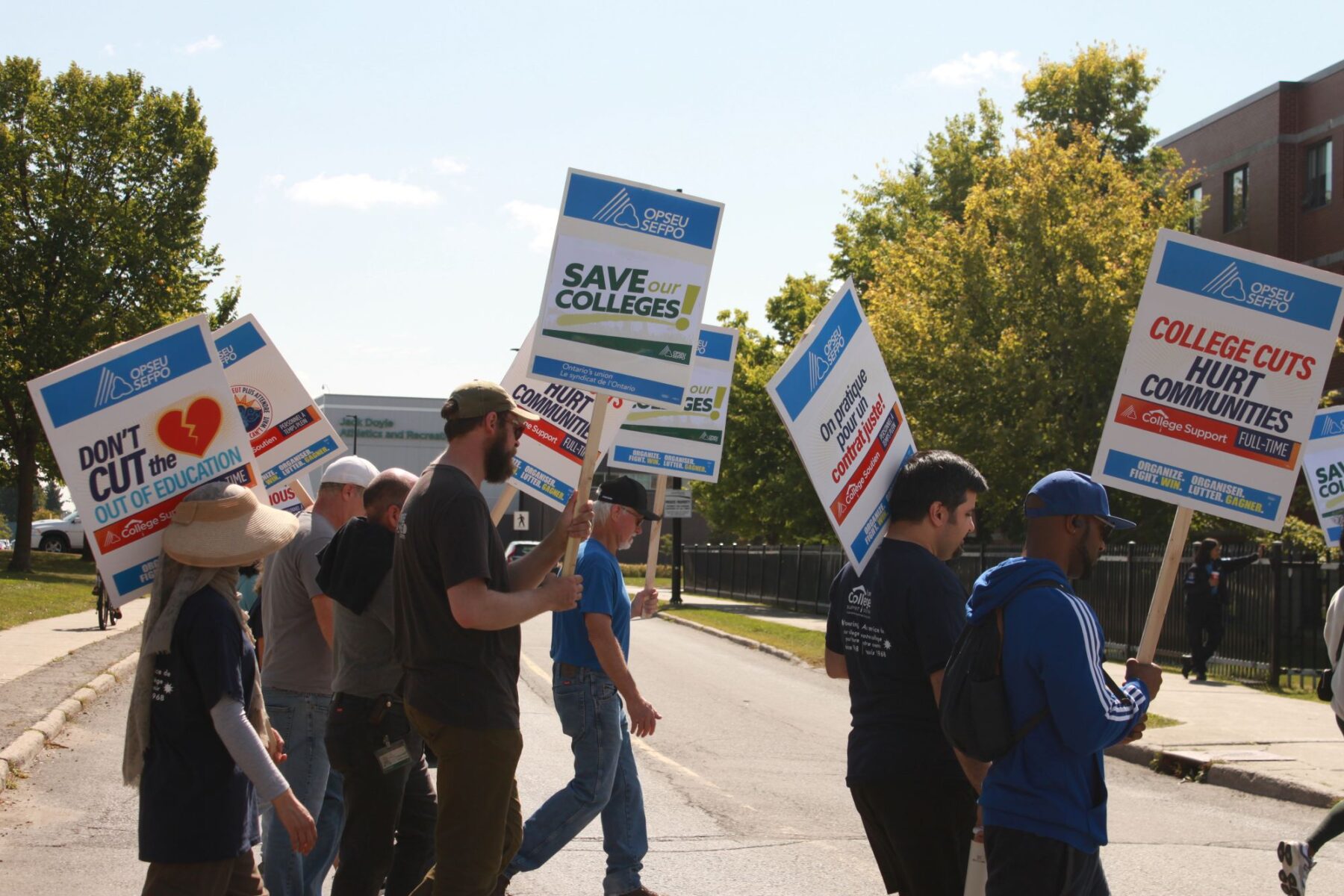 Algonquin College support staff on strike protest service cuts on Navaho Drive on Sept. 11.