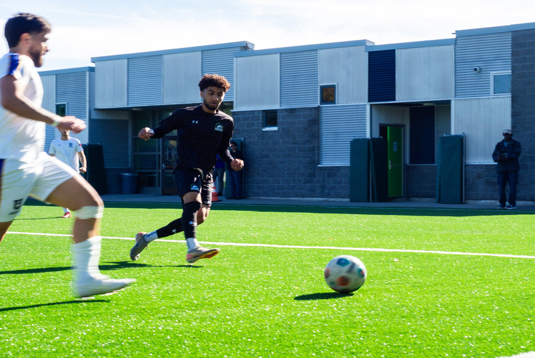 Azeez Al-Hammood moves the ball towards the goal at the Z-building field against the Thunderwolves.
