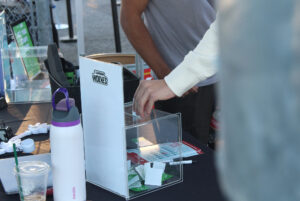 A spectator enters a raffle to be chosen to compete in the half-time game for a chance to win free Wolves merch.