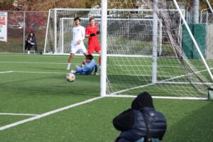 Wolves star, Alessandro Vivolo shoots the ball just wide of the net.