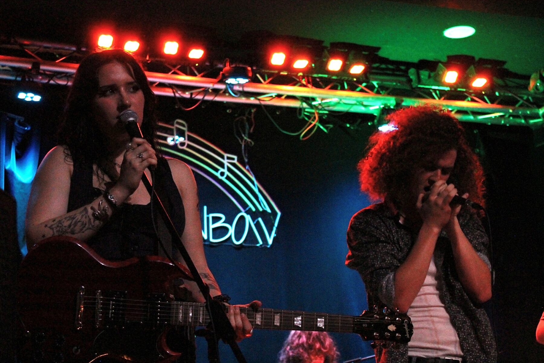 Leeah Sullivan (left) plays guitar and sings beside Thomas Burr at the Rainbow Bistro on Aug. 30, 2025.
