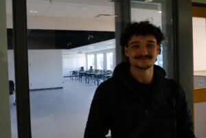 First-year paramedic student Matteo D'Amore, standing in front of the new lab.