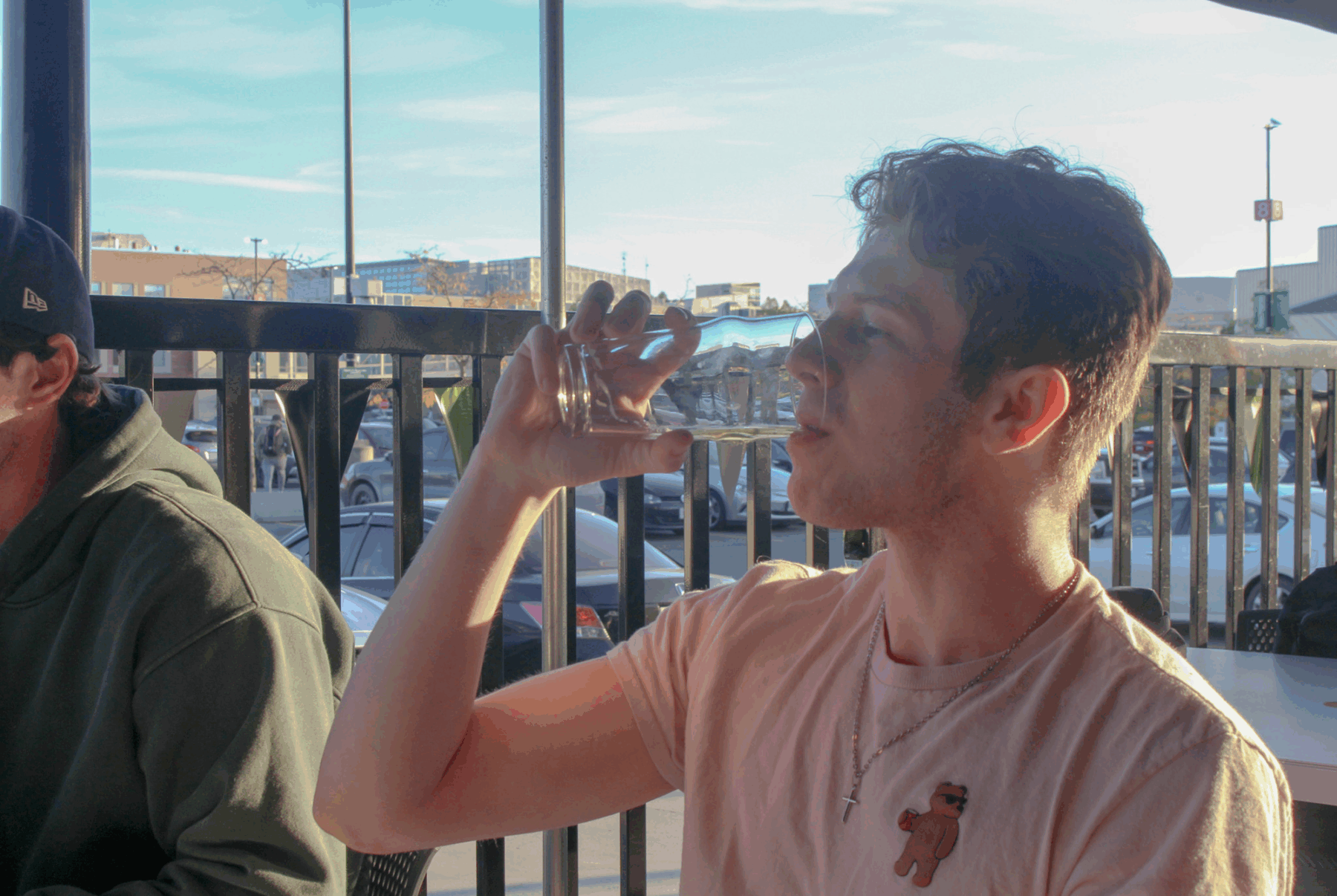 Nicolas Paquette enjoys the last sip of his beer on the Wolves Den terrace.