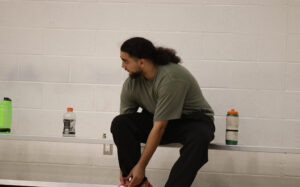 Farouk Meguader tying his shoes at the Jack Doyle athletic and recreation centre on Oct. 20.