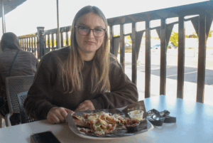 Arianna Cuglietta splurges on a $20 plate of nachos at the Wolves' Den.