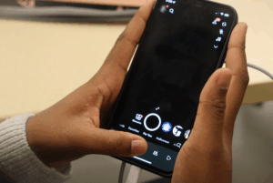An Algonquin College Student opening Snapchat