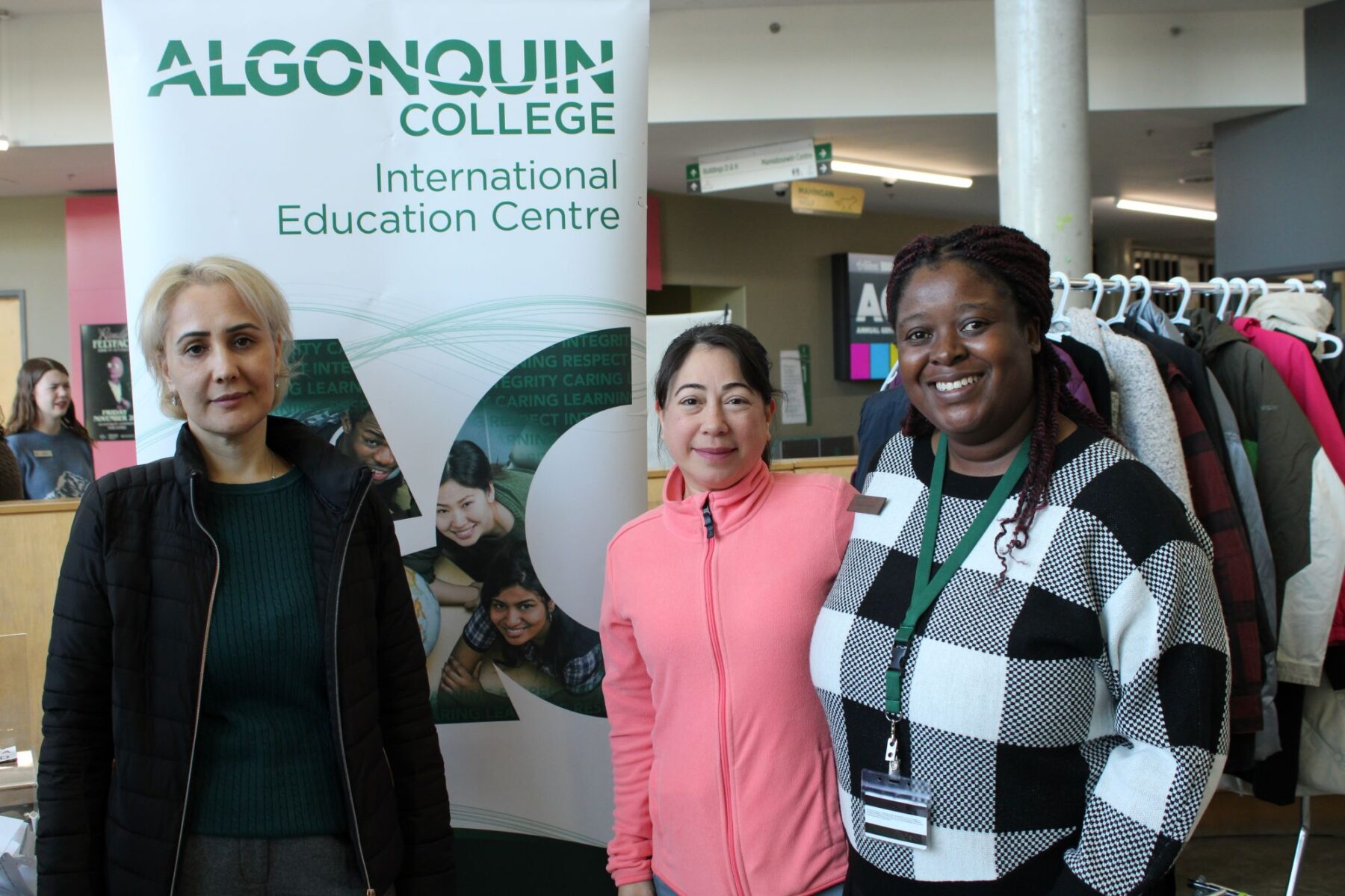 Ozlem Telli (middle) and her friend pose with Sibeso Kehinde (right) from the International Education Centre during Algonquin College’s Winter for Beginners event.