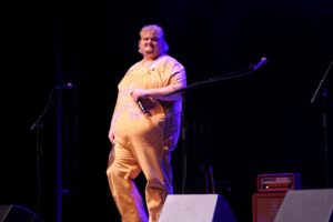 TALK speaking and engaging with the audience on stage at Meridian Theatres at Centrepointe during Rock the Wild