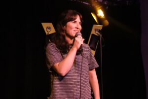 Comedian Kyra Carleton on stage for the Sex positive stand-up special All-Star Edition.