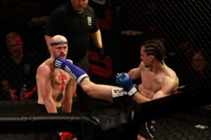 Nickita Darii kicking Winged C in the face