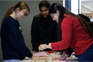 Students collaborate to solve a puzzle for their next clue on Oct. 28th.