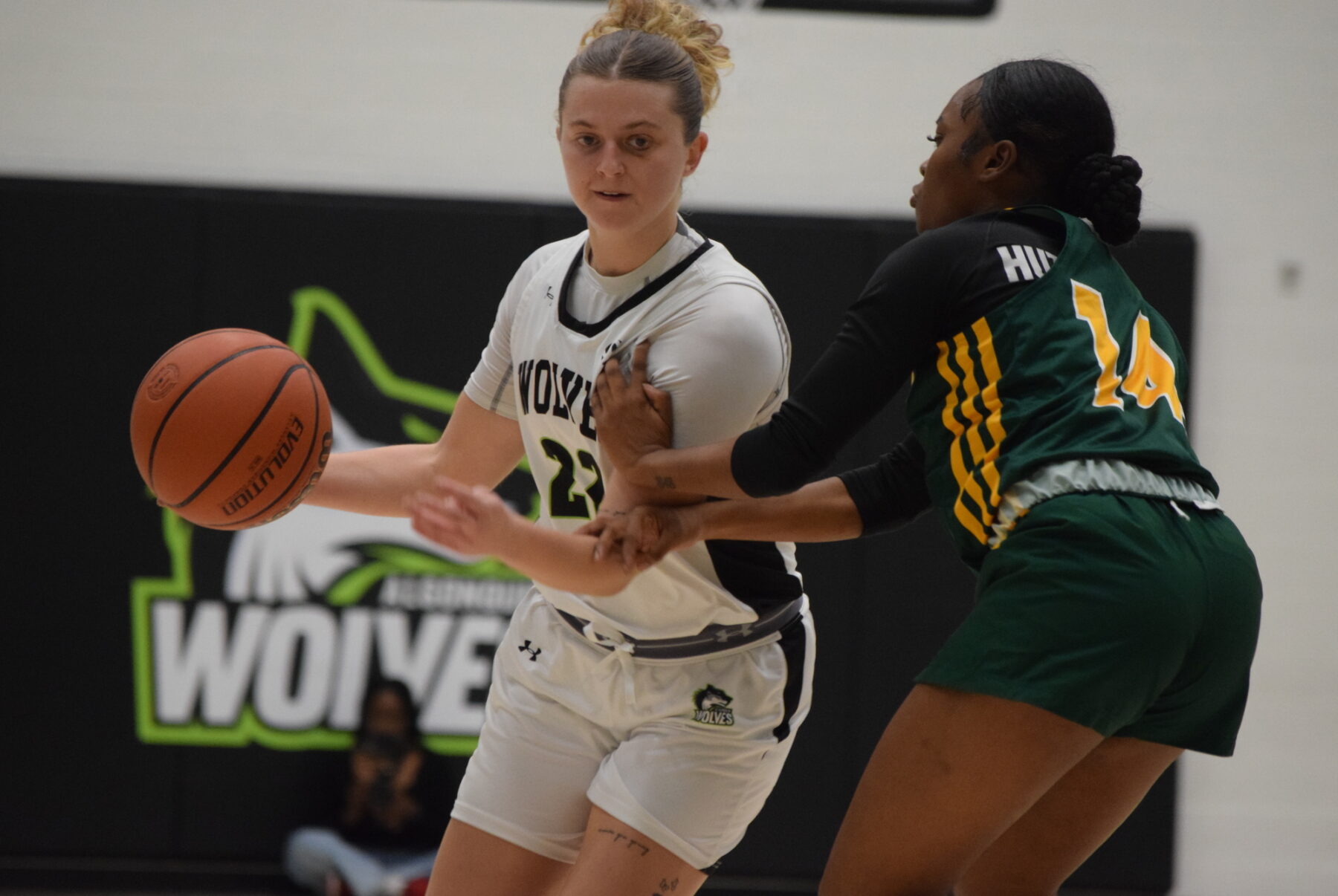 The Wolves' Taryn Mitchell presses Taniya Hutchinson during the third quarter on Oct. 31 for their first varsity game against the Durham Lords this season.