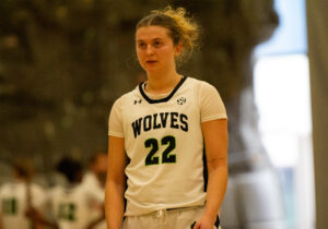 Algonquin Wolves women's basketball team guard Taryn Mitchell lines up to shoot free throws against the Centennial Colts.