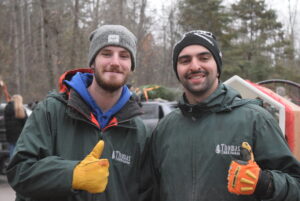 Matthew Thomas (Left) and David Olynik (Right) pause from their daily tree bailing activities at Thomas Tree farm on Nov. 28