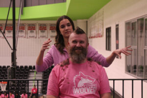 Jaime McLean receives a mohawk cut as part of the fundraiser.