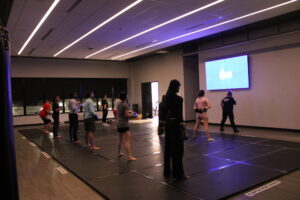 The group pops into their boxing stance as they wait for Julie Parker’s next count during the Nov. 27 class.