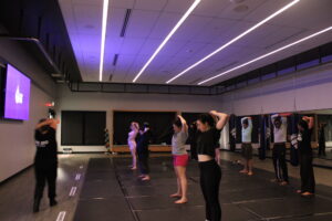 Participants stretch after an energizing boxing class on Nov. 27 at the Jack Doyle Athletics and Recreation Centre.